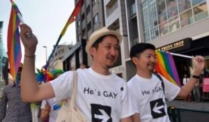 Two Japanese men take part in an LGBT rainbow rally in Tokyo. Photo: AFP