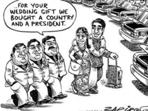 South African cartoon about Vela Gupta marriage to Aaskash Jahajgarhia in Sun City, South Africa, in 2013. The wedding prompted controversy as the government granted permission to land a large party of wedding guests at a military air force base.