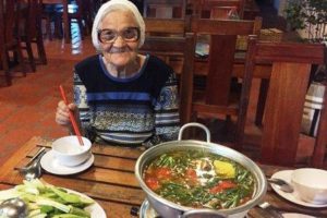 Granny Lena is about to enjoy a bowl of soup in Vietnam