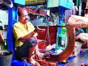 A fishmonger in Calcutta. Pic courtesy Metro